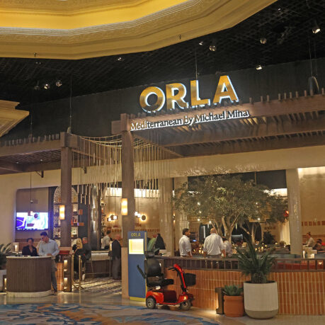 a group of people in a hotel lobby