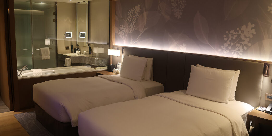 two beds in a hotel room