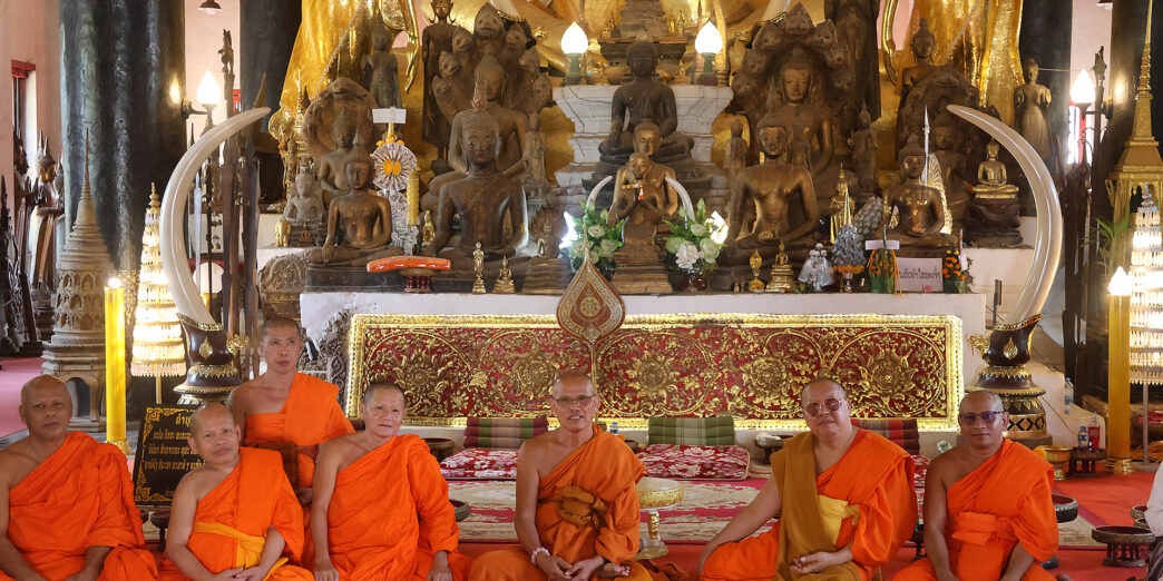 a group of people in orange robes