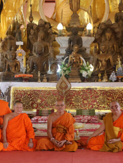 a group of people in orange robes
